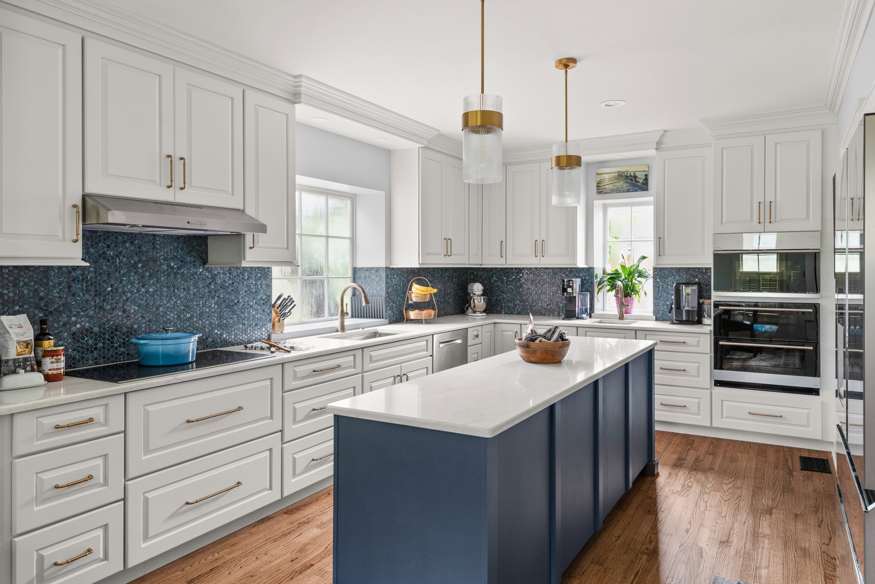 Luxury kitchen remodel with wood cabinetry and stone tops